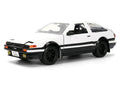 Toyota Trueno (AE86) RHD (Right Hand Drive) White and Black with Graphics and Takumi Diecast Figure "Initial D" (1998-2021) TV Series "Anime Hollywood Rides" Series 1/24 Diecast Model by Jada