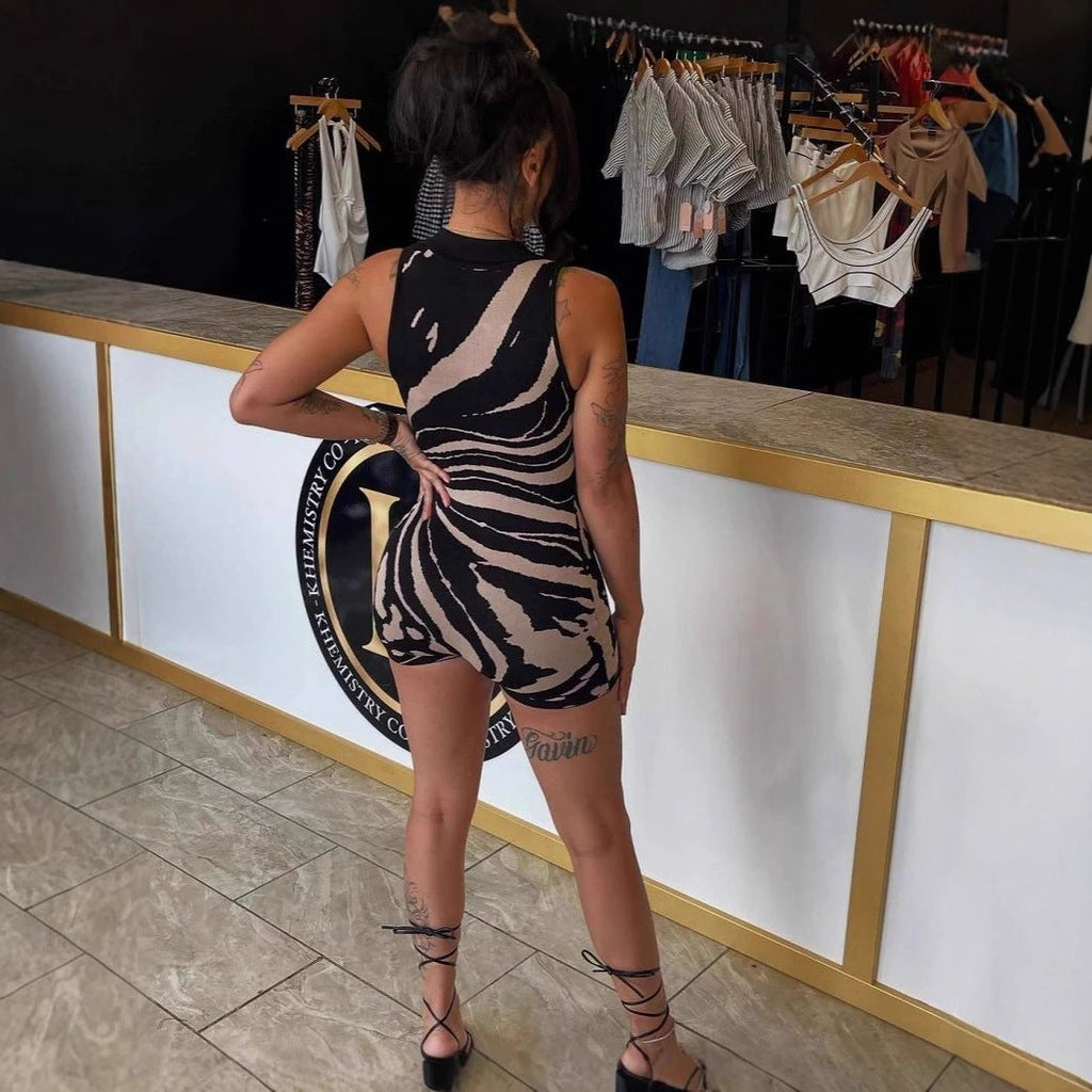 Fashionable Striped Romper With A Half-zip Front And Collar