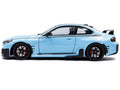 2024 BMW M2 Performance Parts Zandvoort Blue with Carbon Top and Black Stripes 1/18 Diecast Model Car by Solido