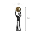 Abstract black and gold human figurine golden ball holder living room