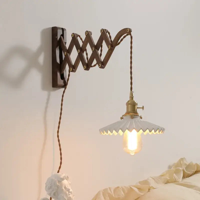 Antique brass ceramic walnut wall sconce with scalloped shade bedroom