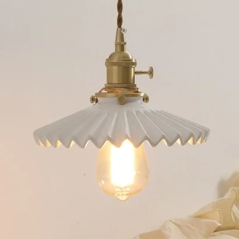 Antique brass ceramic walnut wall sconce with scalloped shade bedroom