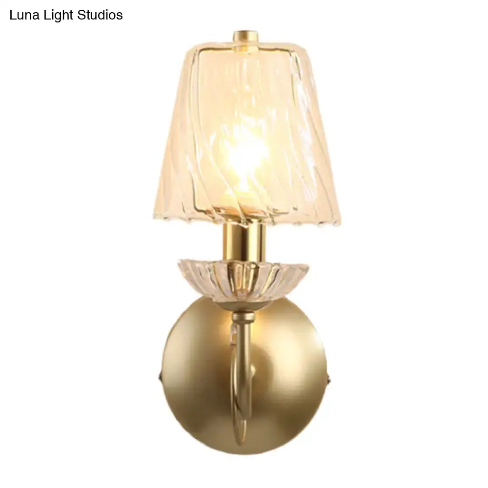 Antique brass conical sconce light with clear twisted glass bedroom