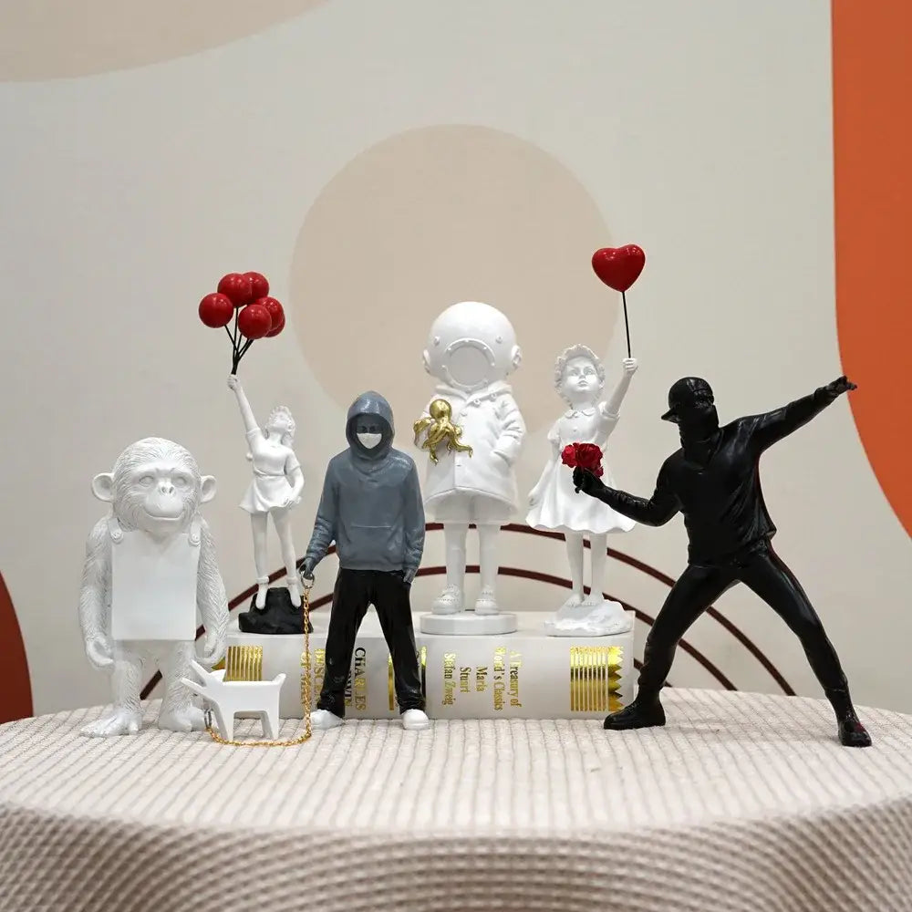 DecorBites™ Banksy Sculpture Collection: Flower Thrower & Balloon Girl Figurines for Home & Office