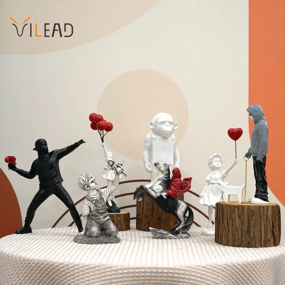 DecorBites™ Banksy Sculpture Collection: Flower Thrower & Balloon Girl Figurines for Home & Office