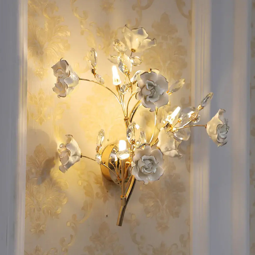 DecorBites™ Contemporary Gold Crystal Wall Lamp with Teardrop Faceted Design and Ceramic Flower Accents - 3 Bulb Wall Light Fixture