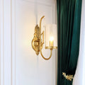 Contemporary gold wall light bedroom sconce with clear glass shade