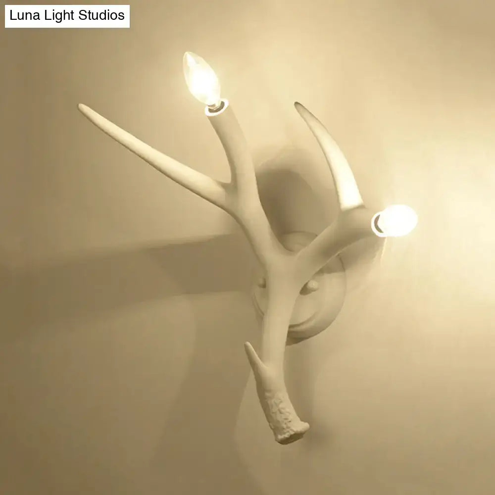 Contemporary white resin antler wall sconce for restaurant dining room