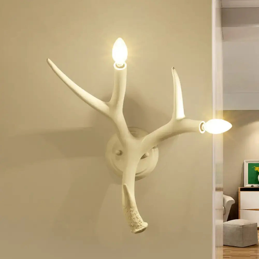 Contemporary white resin antler wall sconce for restaurant dining room