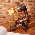 Industrial antiqued bronze robot table lamp bedroom nightstand light