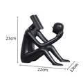 Modern black glossy abstract figure sculpture reading book bedroom decor