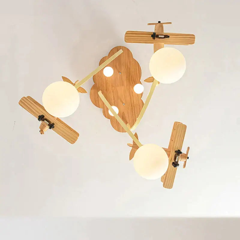 Wooden airplane chandelier light with cloud base for nursery room