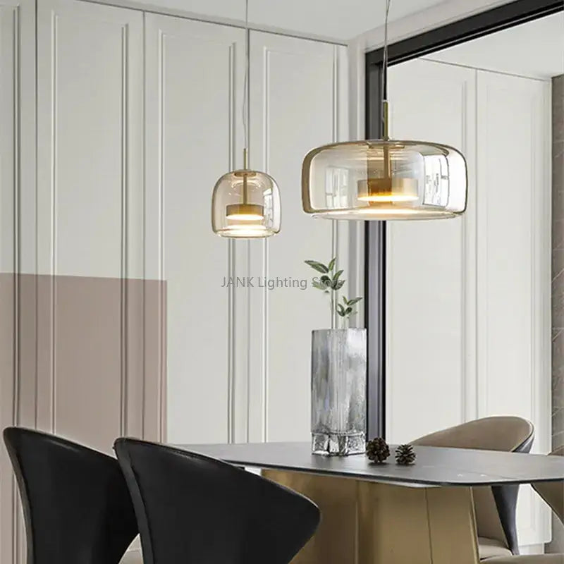 Modern amber glass chandelier with brass accents for living room