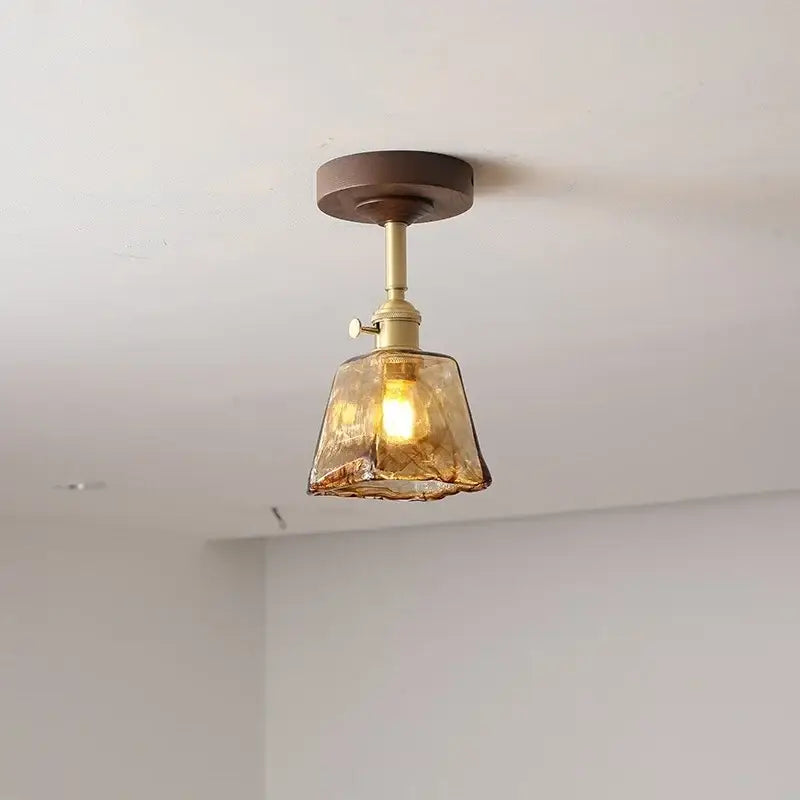 Modern amber glass and copper ceiling light fixture dining room