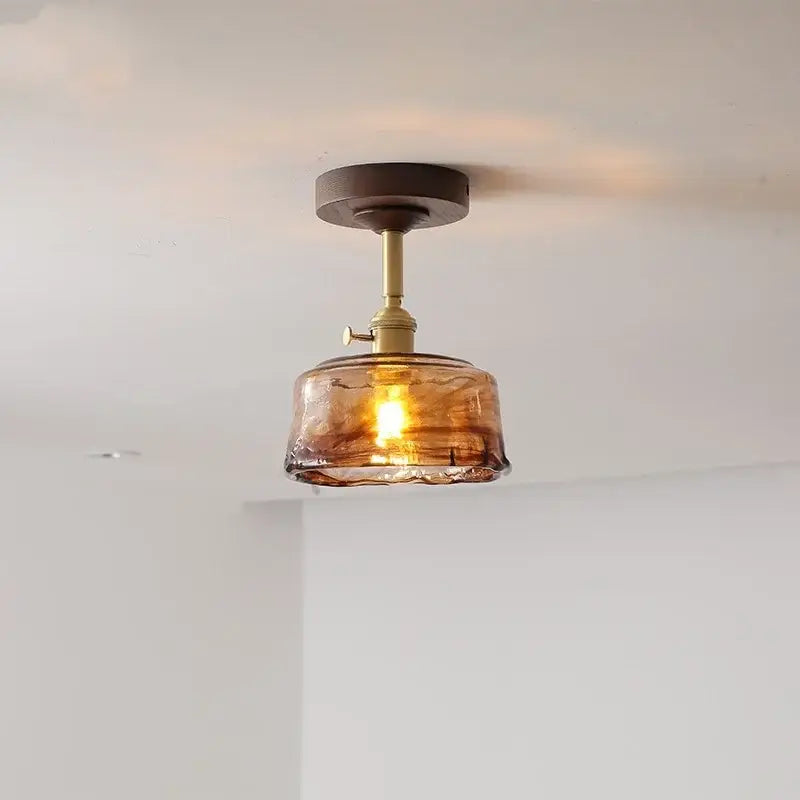 Modern amber glass and copper ceiling light fixture dining room