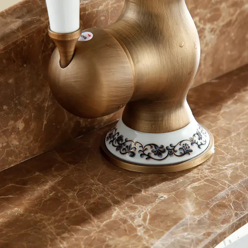 Antique brass and white ceramic bathroom sink faucet swivel spout