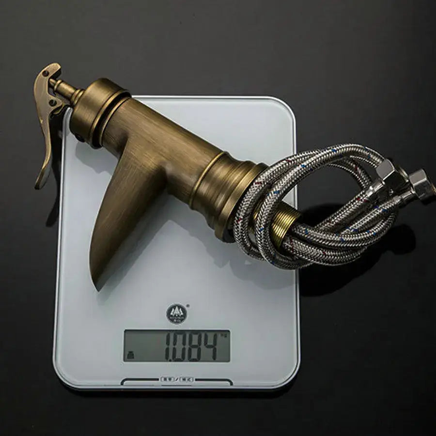 Antique brass waterfall basin faucet with art handle for bathroom