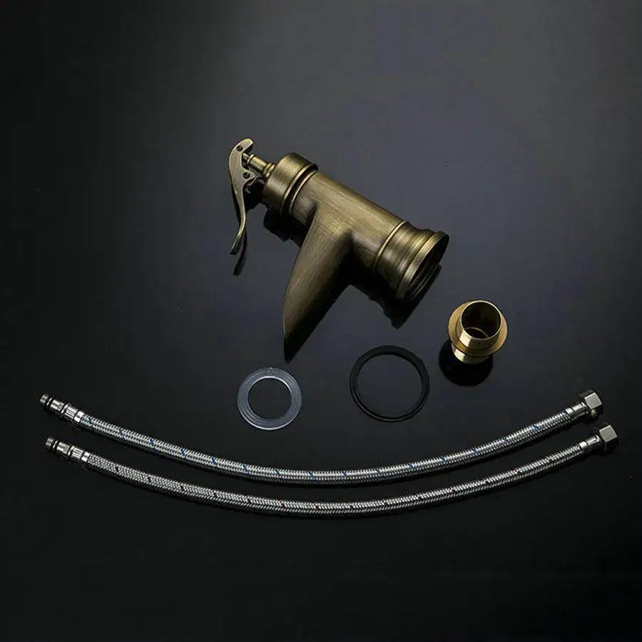 Antique brass waterfall basin faucet with art handle for bathroom