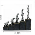 Silver man evolution sculpture – living room resin artwork decor