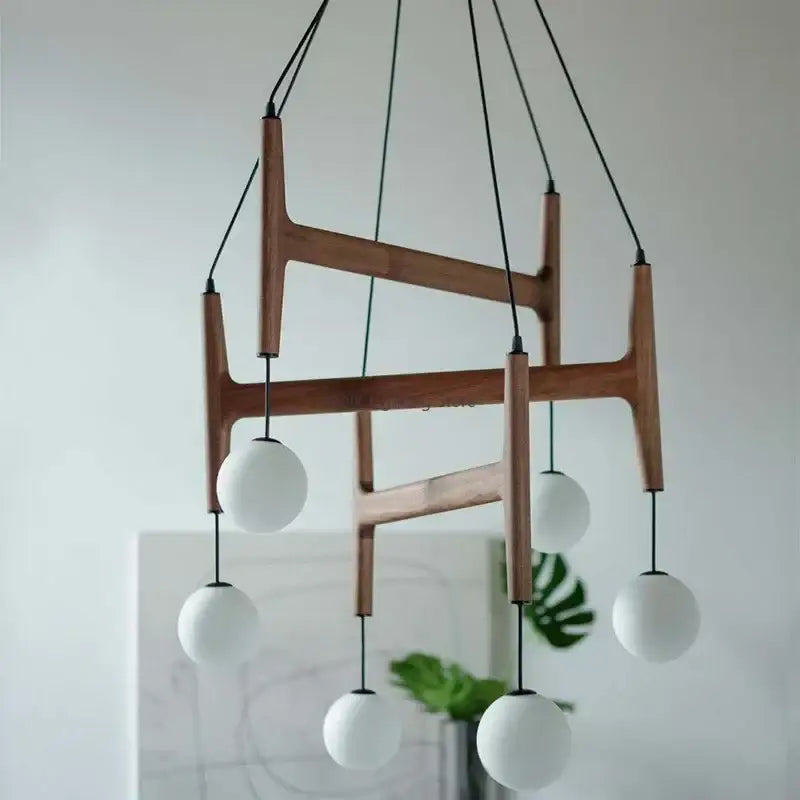 Modern astra wood pendant light with white glass shades dining room