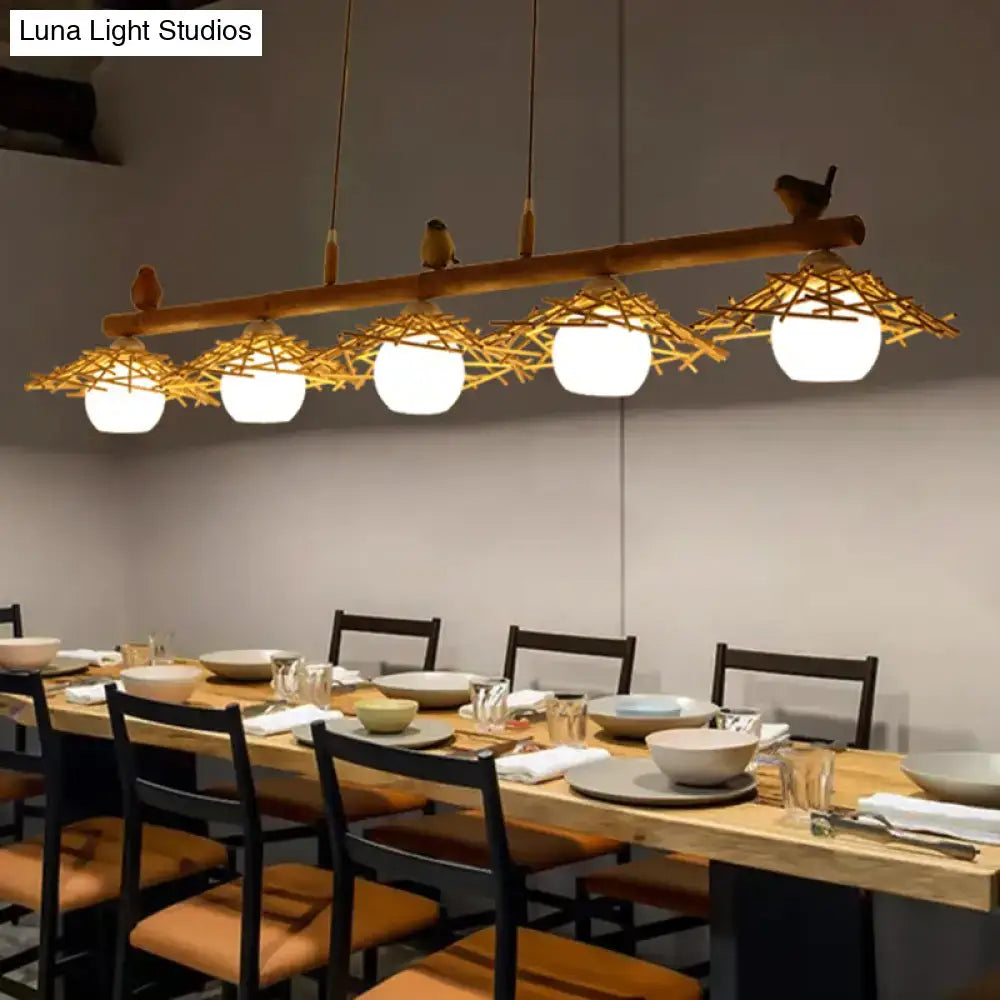 Rustic bamboo pendant with birds and white glass globe dining room