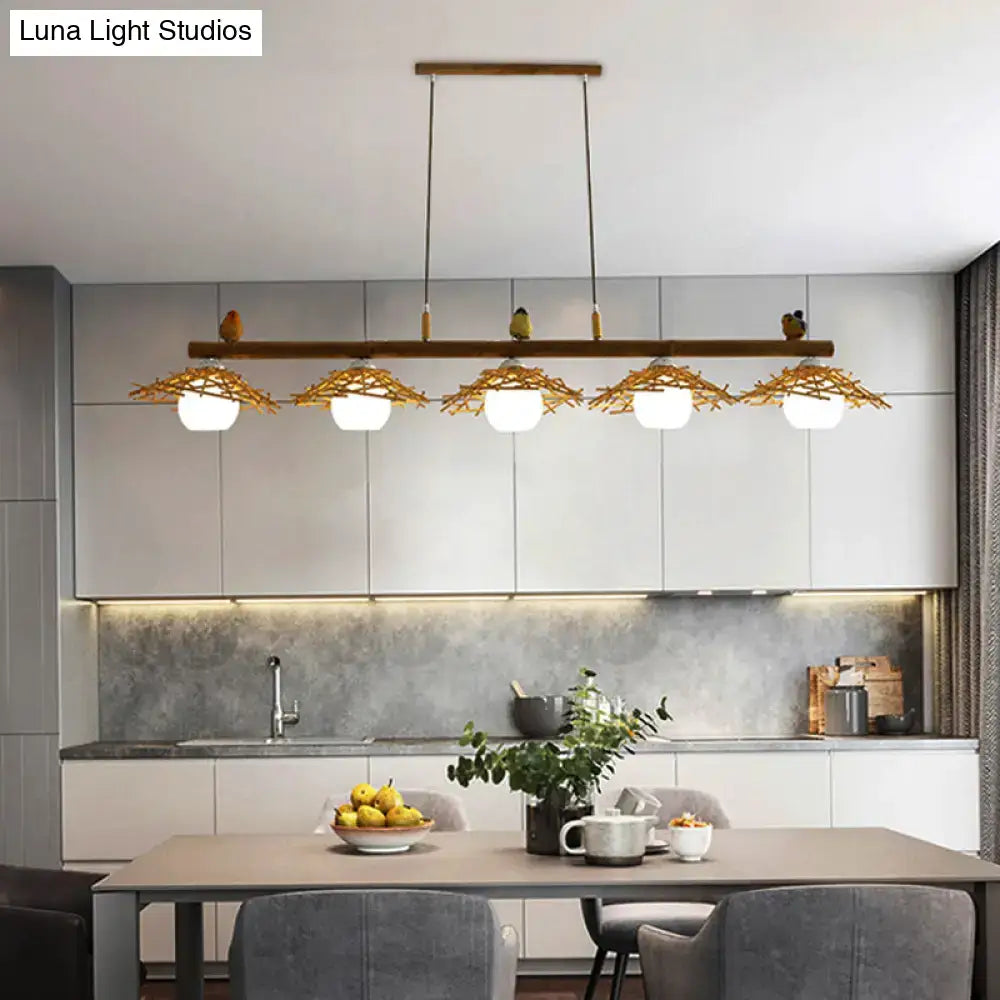 Rustic bamboo pendant with birds and white glass globe dining room