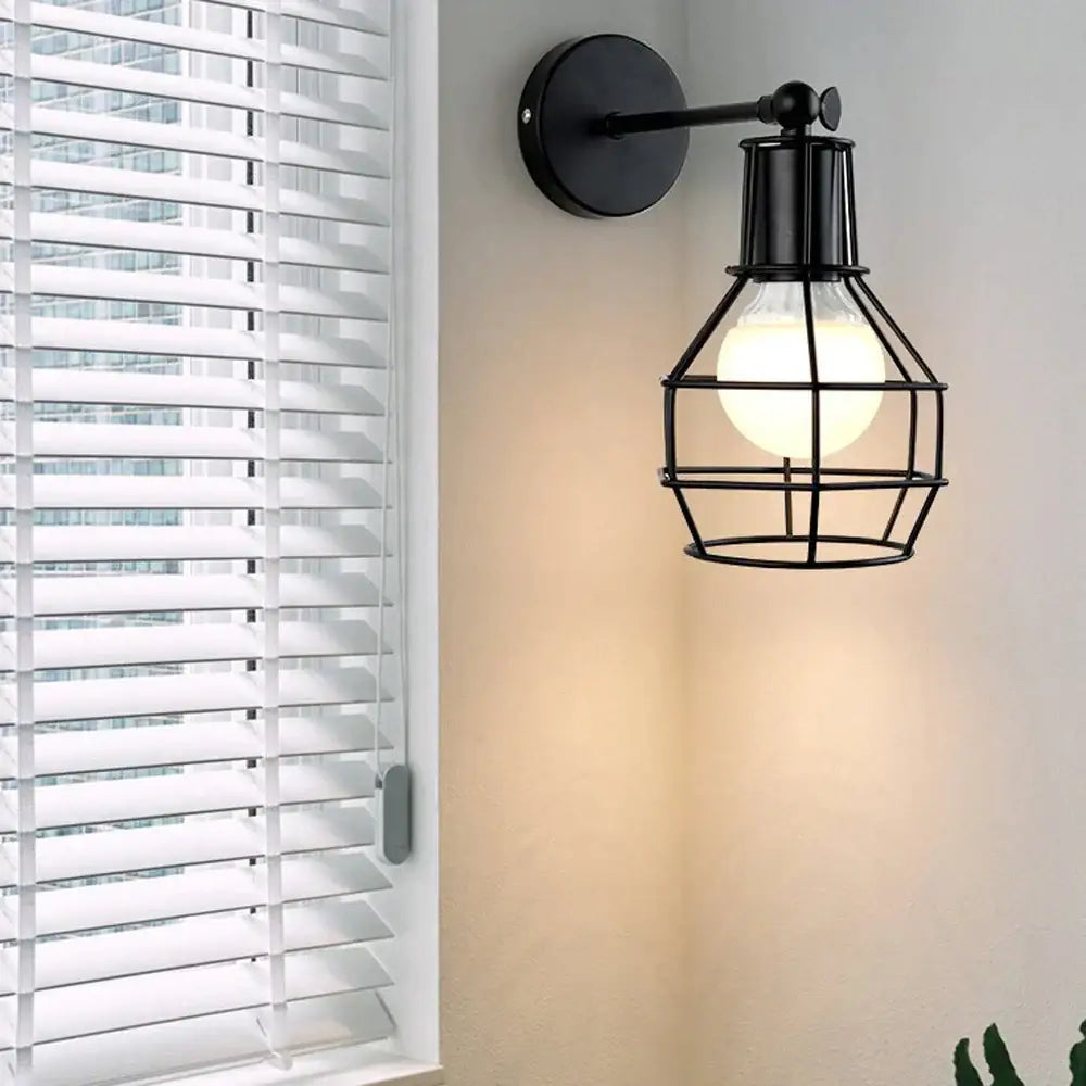 Retro black iron cage wall lamp for bedroom with amber bulb