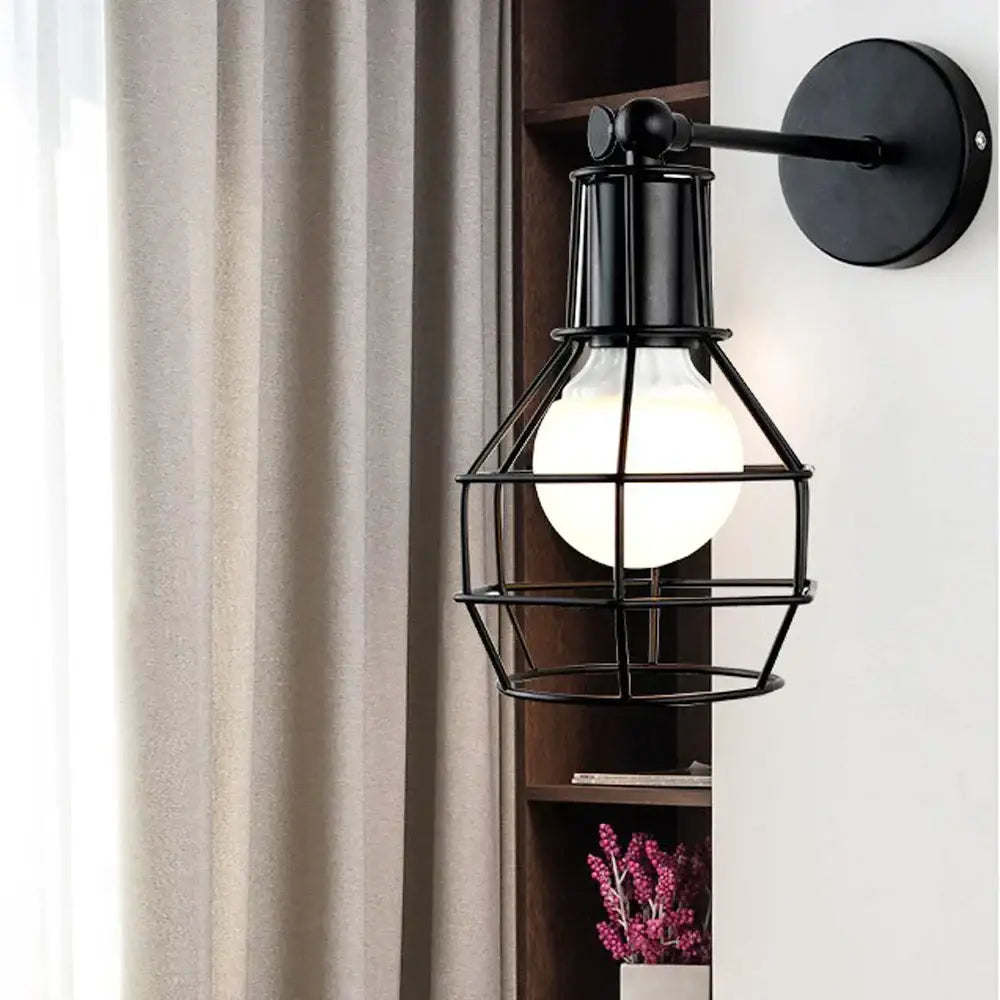 Retro black iron cage wall lamp for bedroom with amber bulb