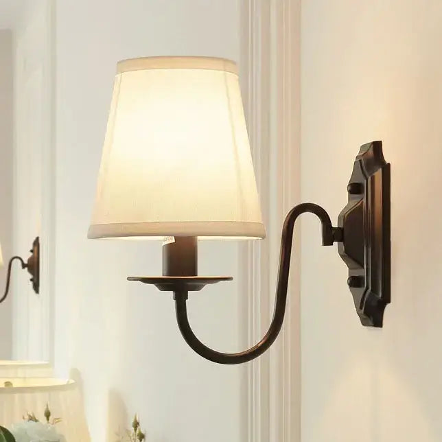 Antique bronze iron wall lamp with cream fabric shade for bedroom