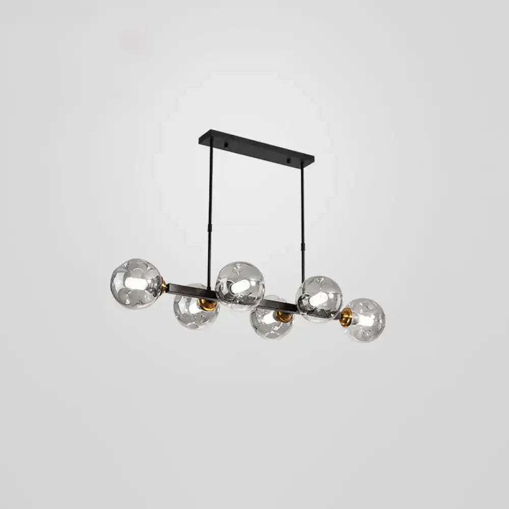 Modern black and brass globe shade pendant light for dining room