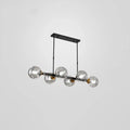 Modern black and brass globe shade pendant light for dining room