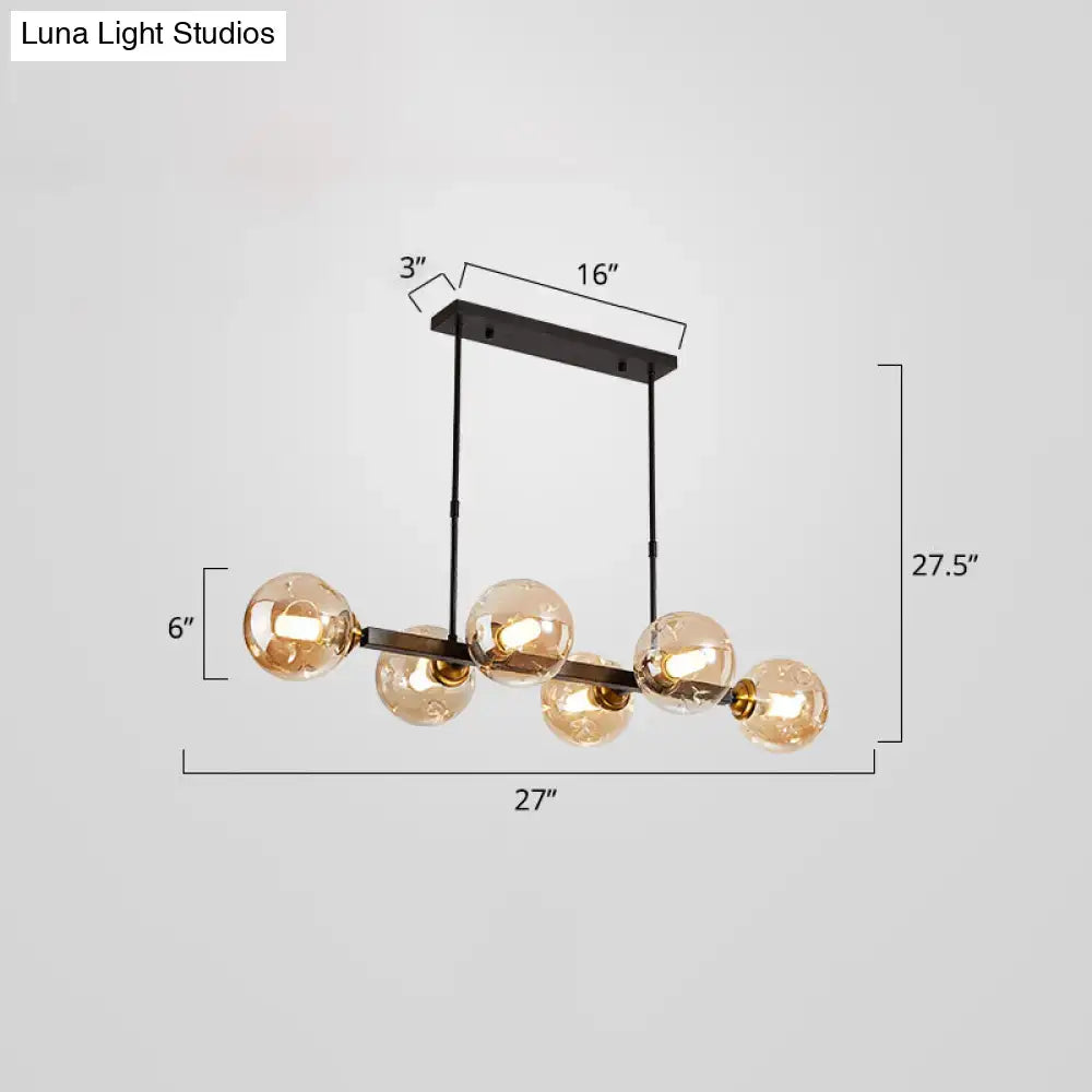 Modern black and brass globe shade pendant light for dining room