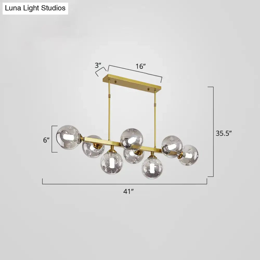 Modern black and brass globe shade pendant light for dining room