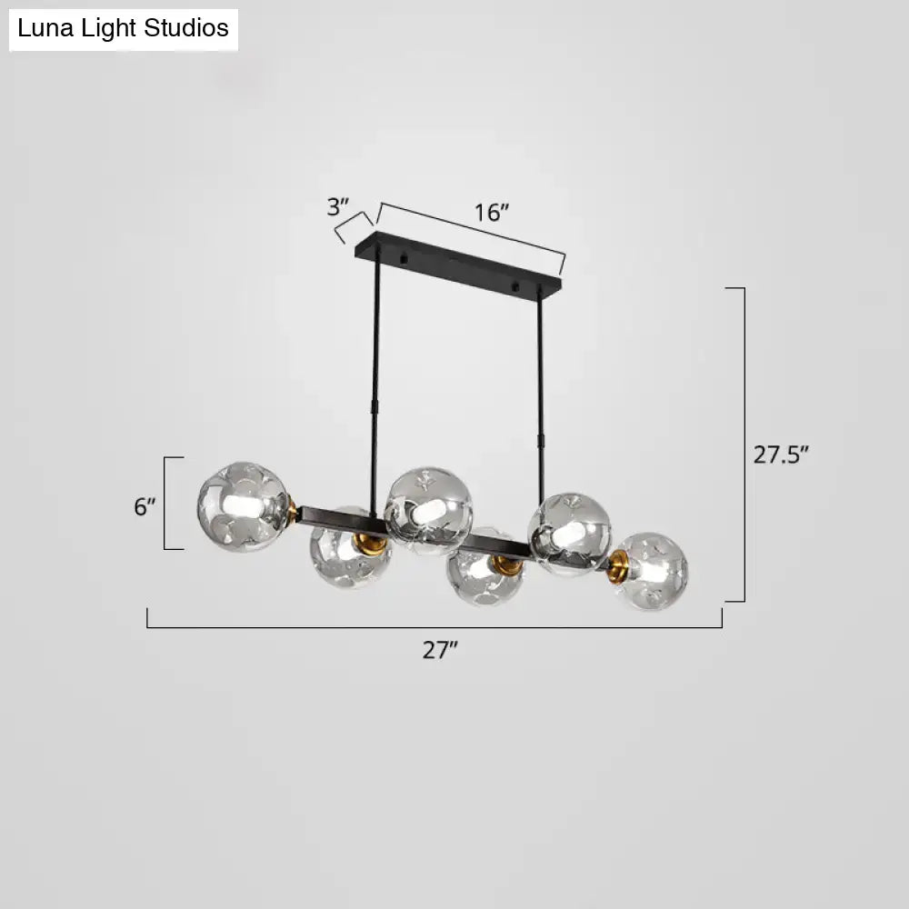 Modern black and brass globe shade pendant light for dining room