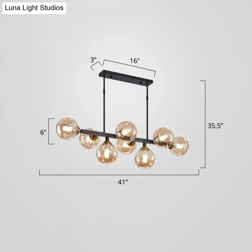 Modern black and brass globe shade pendant light for dining room