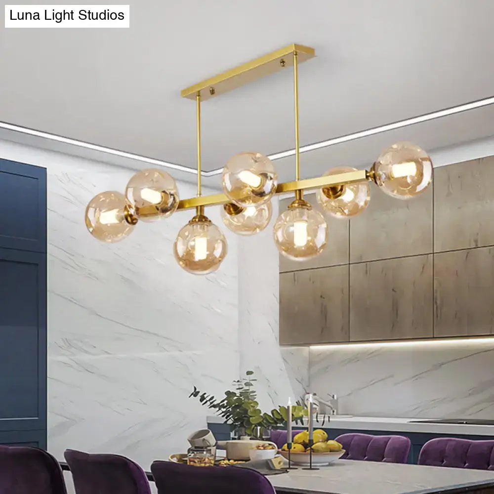 Modern black and brass globe shade pendant light for dining room