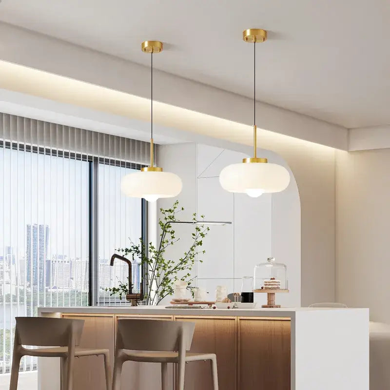 Sleek amber glass and copper pendant light for kitchens