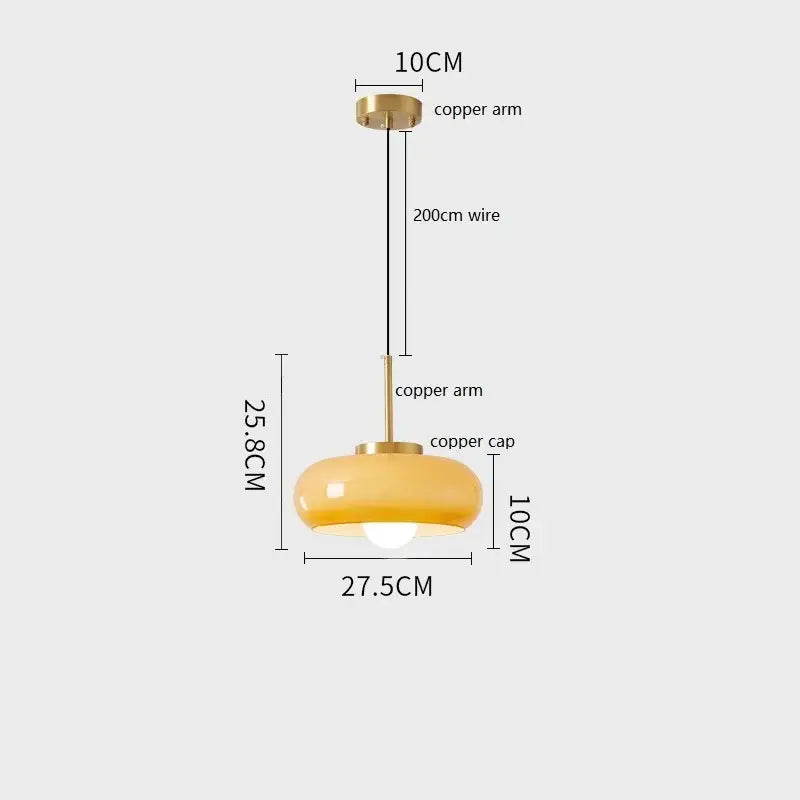 Sleek amber glass and copper pendant light for kitchens