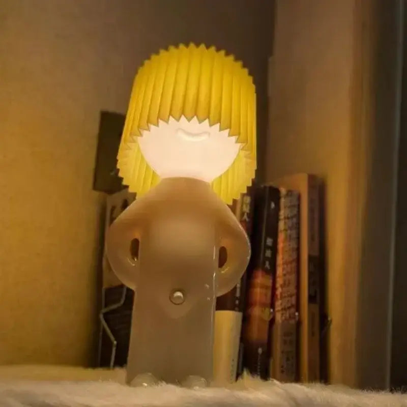 Whimsical beige and yellow naughty boy table lamp for bedroom bedside
