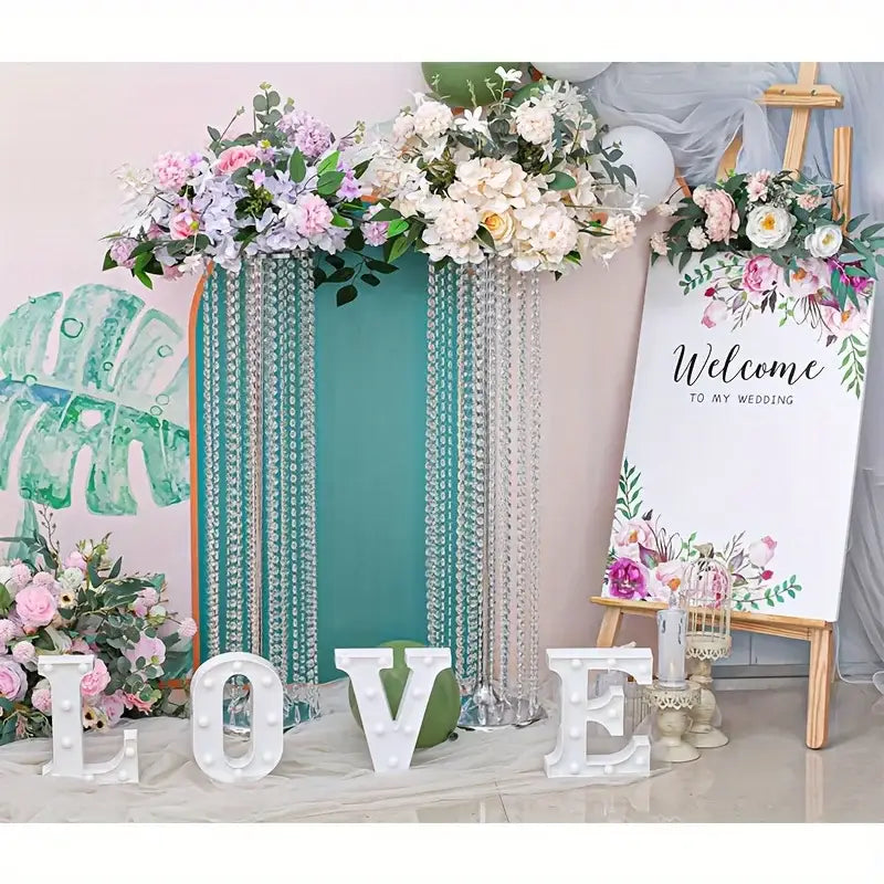 Elegant gold metal vases with crystals and roses wedding decor
