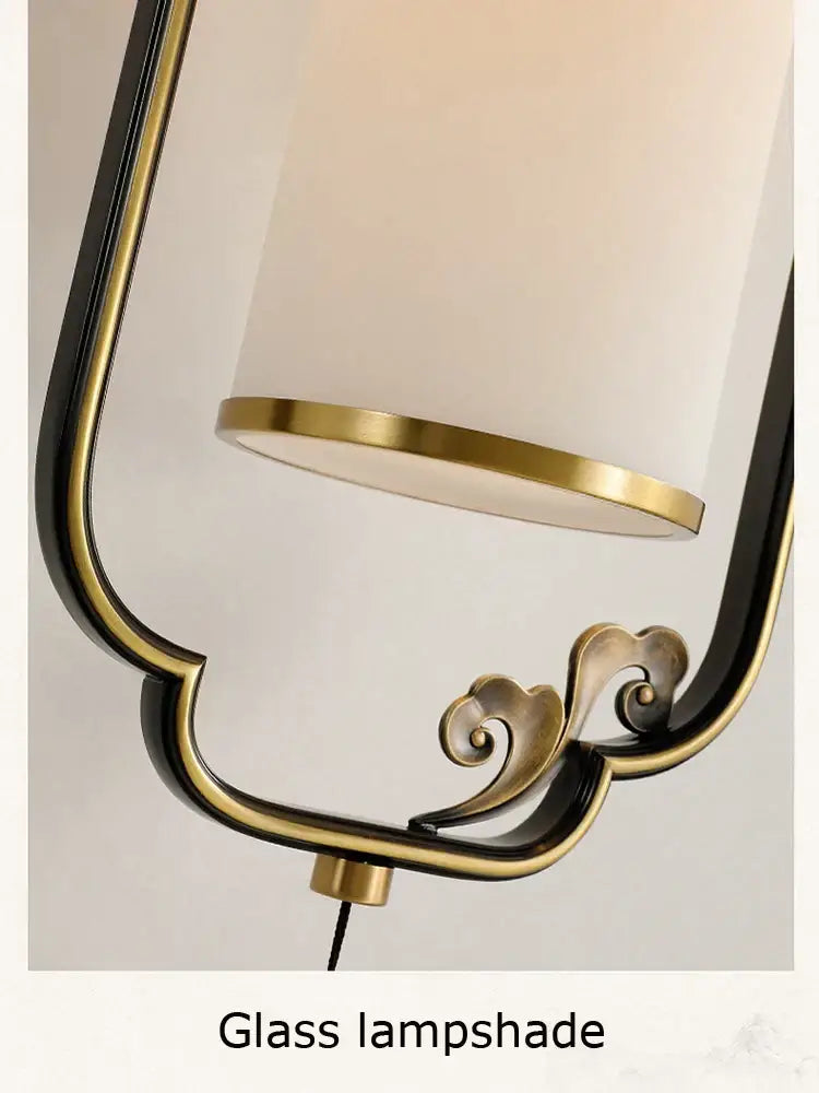 Ornate brass glass wall lamp for living room with frosted shade