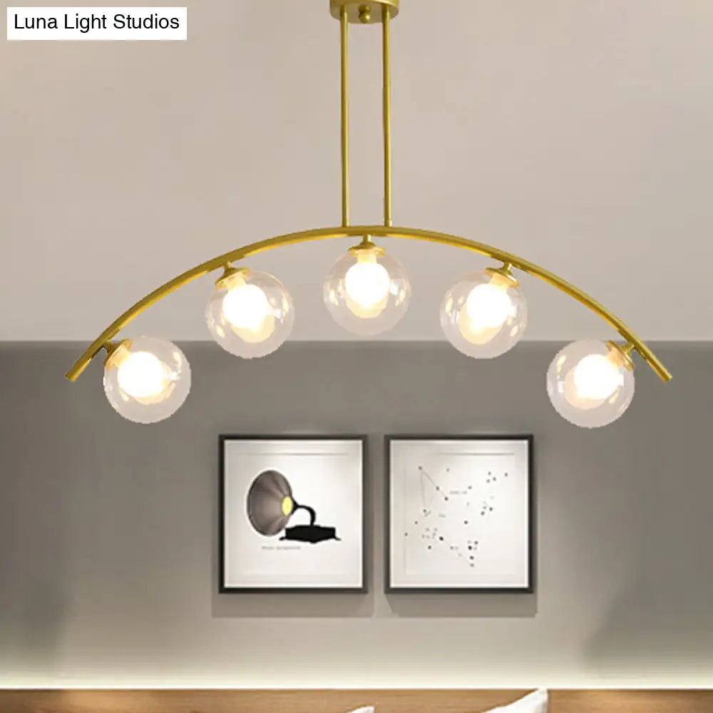 Modern gold island pendant with clear white shade for kitchens