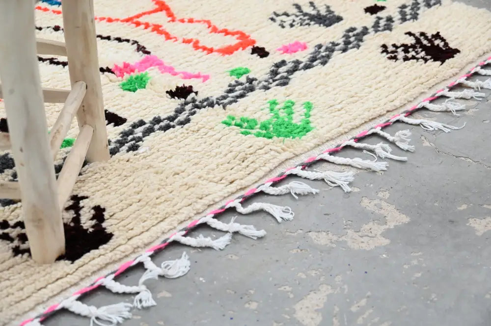 Handmade azilal rug with vibrant colors in natural wool living room