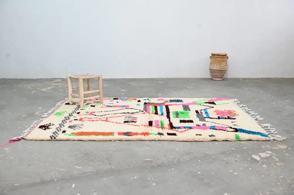 Handmade azilal rug with vibrant colors in natural wool living room