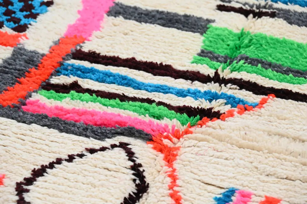 Handmade azilal rug with vibrant colors in natural wool living room