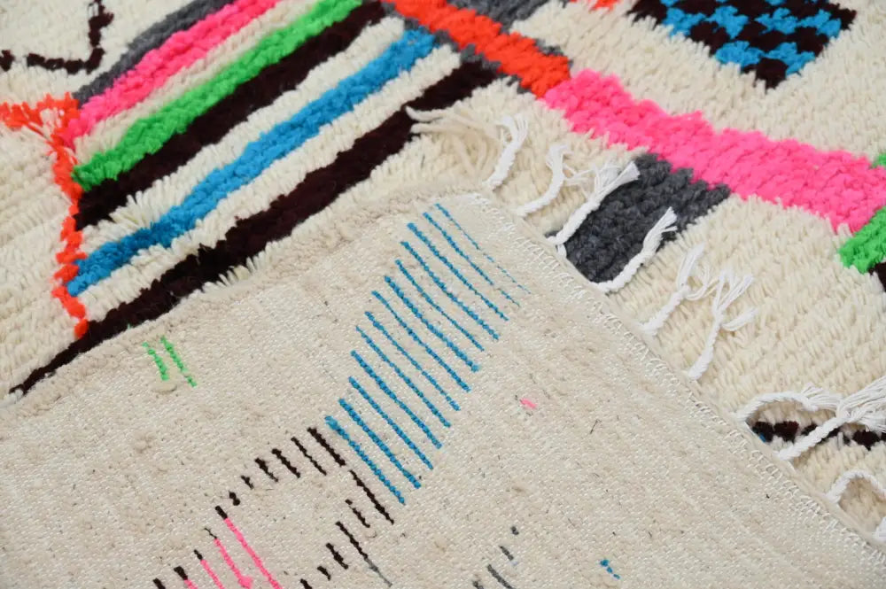 Handmade azilal rug with vibrant colors in natural wool living room