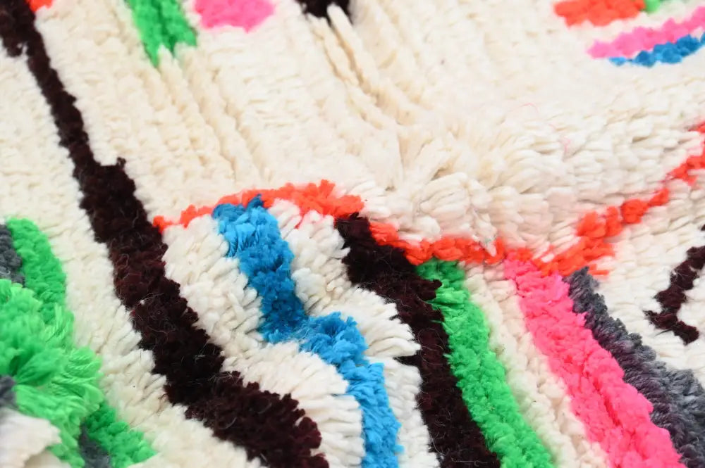 Handmade azilal rug with vibrant colors in natural wool living room