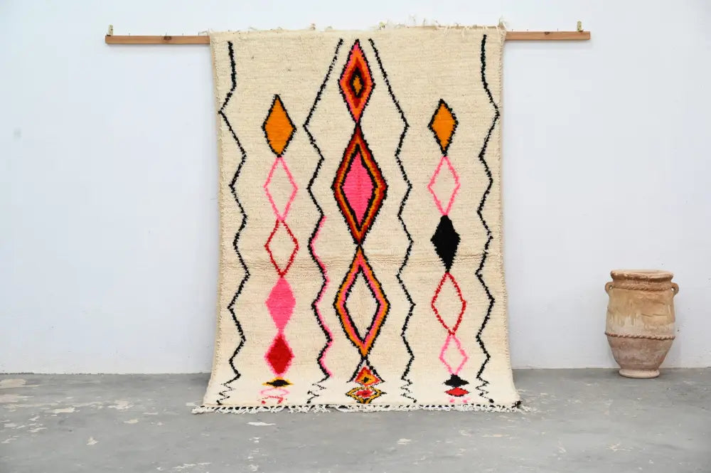 Handmade beige azilal rug with geometric patterns bedroom decor