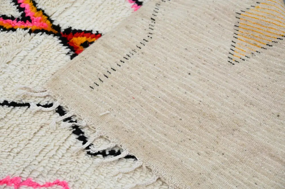 Handmade beige azilal rug with geometric patterns bedroom decor