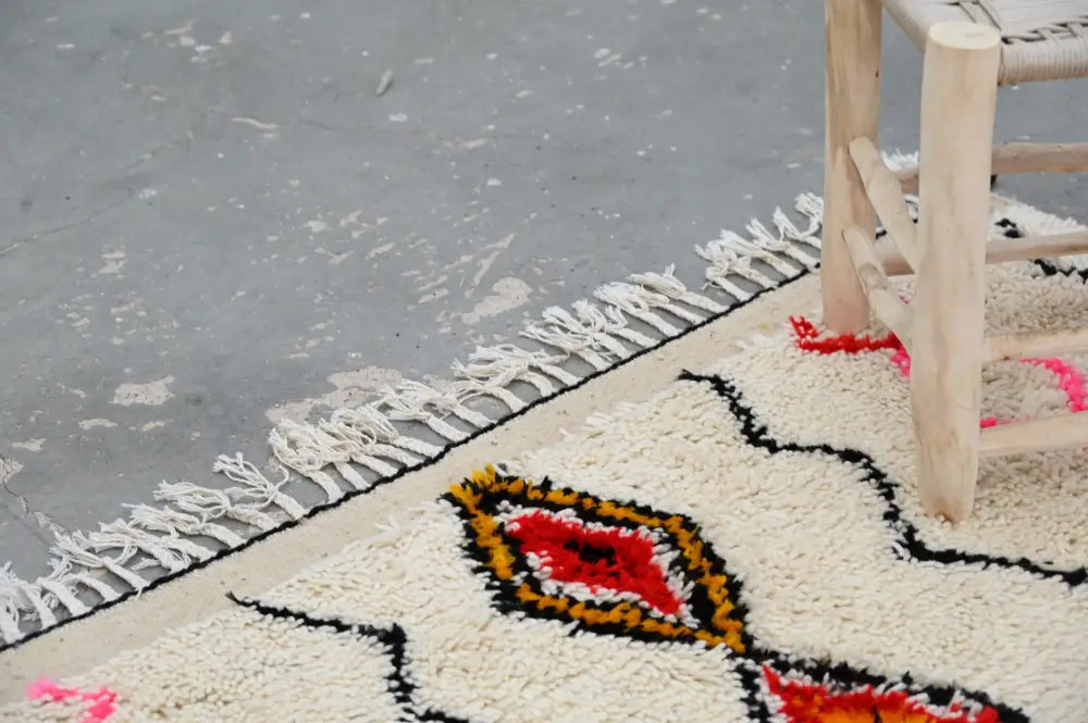 Handmade beige azilal rug with geometric patterns bedroom decor